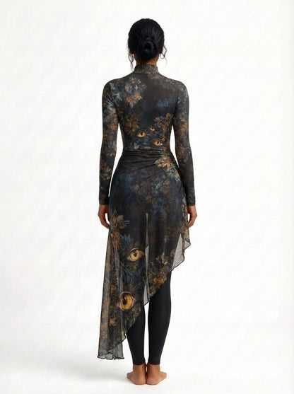Woman wearing a long-sleeve, high-low dress with a floral pattern on a white background