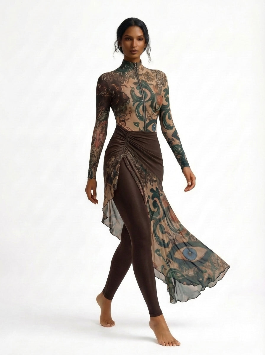 Woman wearing a long-sleeve top and skirt with intricate patterns on a white background