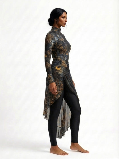 Woman wearing a long, patterned dress with a high-low hem on a white background