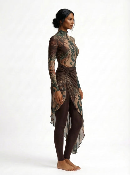 Woman wearing a long-sleeve, high-low dress with a camouflage pattern on a white background