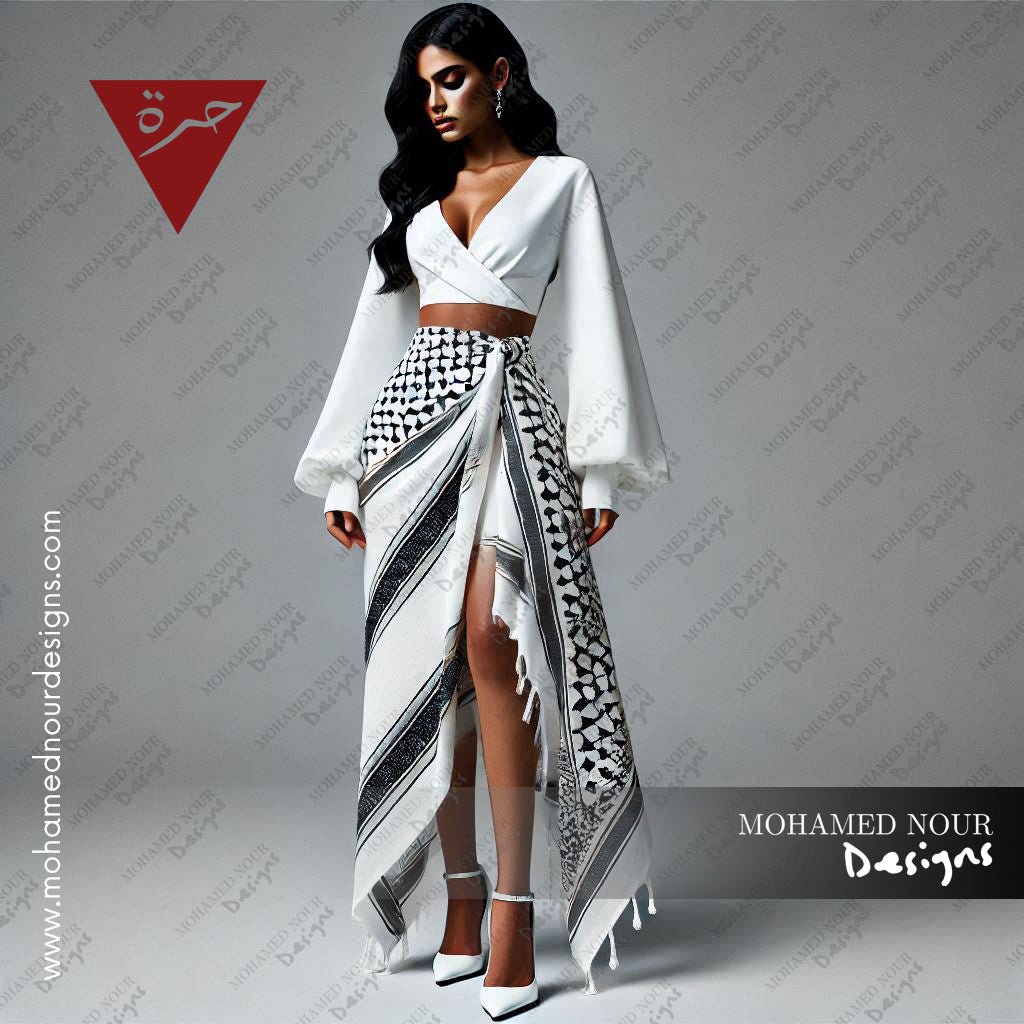 Contemporary white and black asymmetric skirt from the HORRA collection by MNour Design, featuring keffiyeh-inspired patterns and delicate fringe details. Paired with a sleek white sleeveless top for a modern yet culturally rooted look. Explore the collection at www.mnourdesign.com